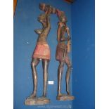 Two carved ethnic figures, 30'' long.