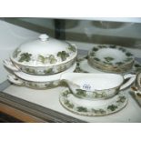 A part Royal Worcester dinner service by The Worcester Hop in 'Mathon' pattern including lidded
