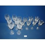 A small quantity of glasses including; 4 etched wine in fuschia design, 6 etched floral champagne,