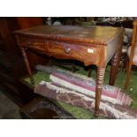 A circa 1900 Mahogany side/writing Table standing on turned legs and having a pair of frieze