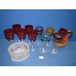 A small quantity of coloured glass including; a red-orange ombre crackle jug with chip to rim,