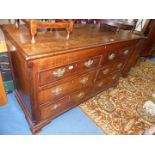 A cross-banded Oak Locker-top Chest having two false short drawers and four true drawers below with