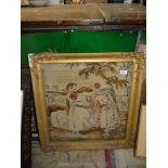 A gilt framed tapestry of a Far Eastern couple, 24 1/2'' x 23'',
