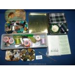 A small quantity of sewing items including reels of thread,, buttons,