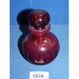 A Ruby red glass stoppered perfume bottle