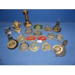 A small quantity of brass including horse brasses, ornate ram head handle inkwell,