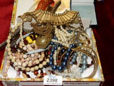 A small quantity of costume jewellery including hair grips, faux pearl necklaces,
