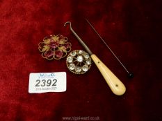 Two period costume jewellery brooches with pink and clear stones, one a/f,