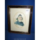 A small framed and mounted oval watercolour of a fisherman wearing a Sou-wester hat and smoking a