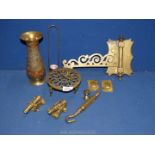 A small quantity of brass including ornate floral vase, trivet, miniature cannons etc.