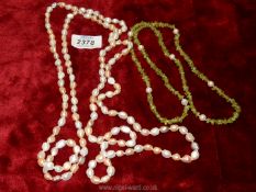 A long length of pink pearls from The Pearl Company, plus a green glass and pearl necklace.