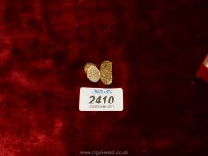 A pair of 9 ct gold cufflinks with floral decoration, makers G.K.W.L.