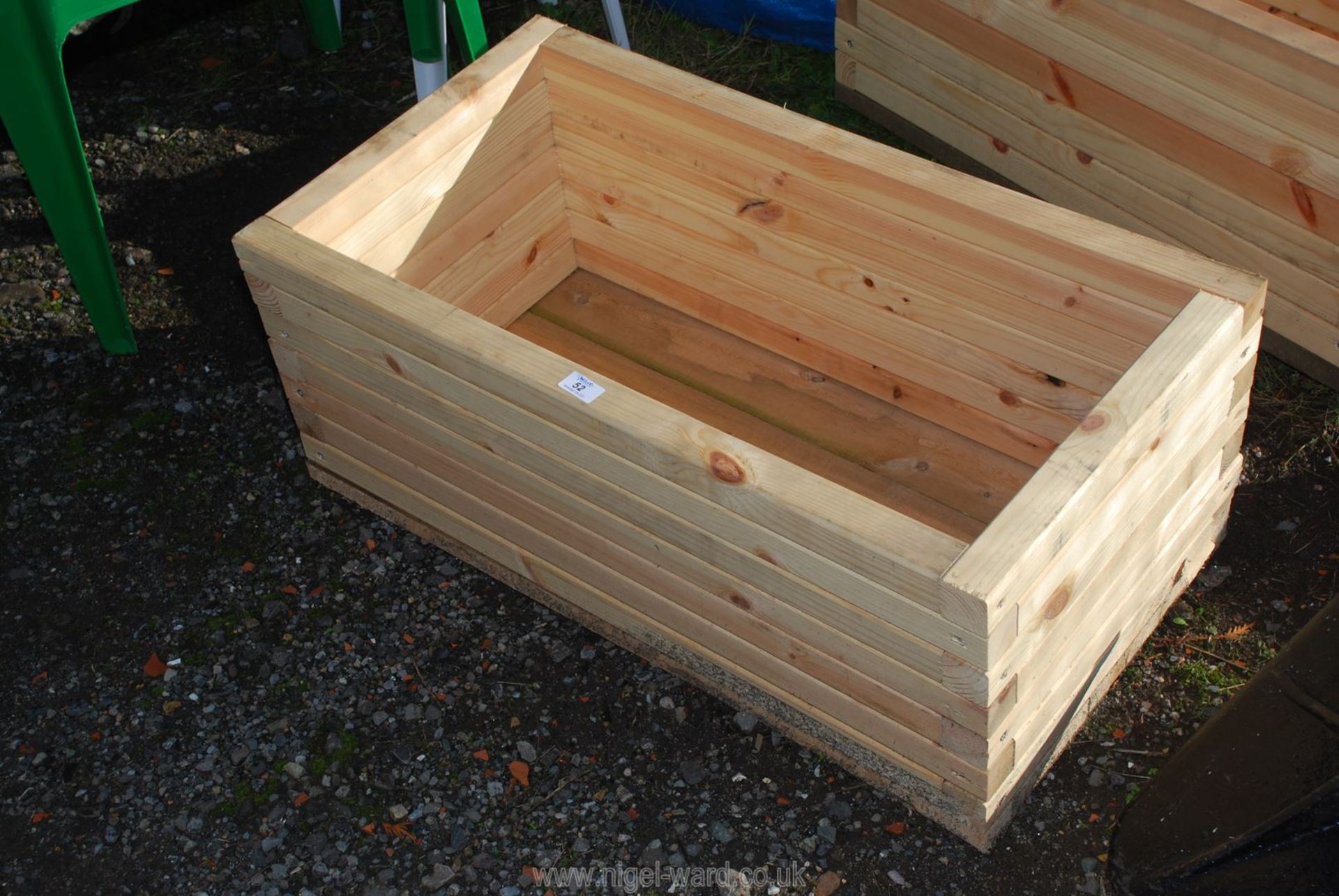 Wooden planter 17'' x 32'' x 13''.