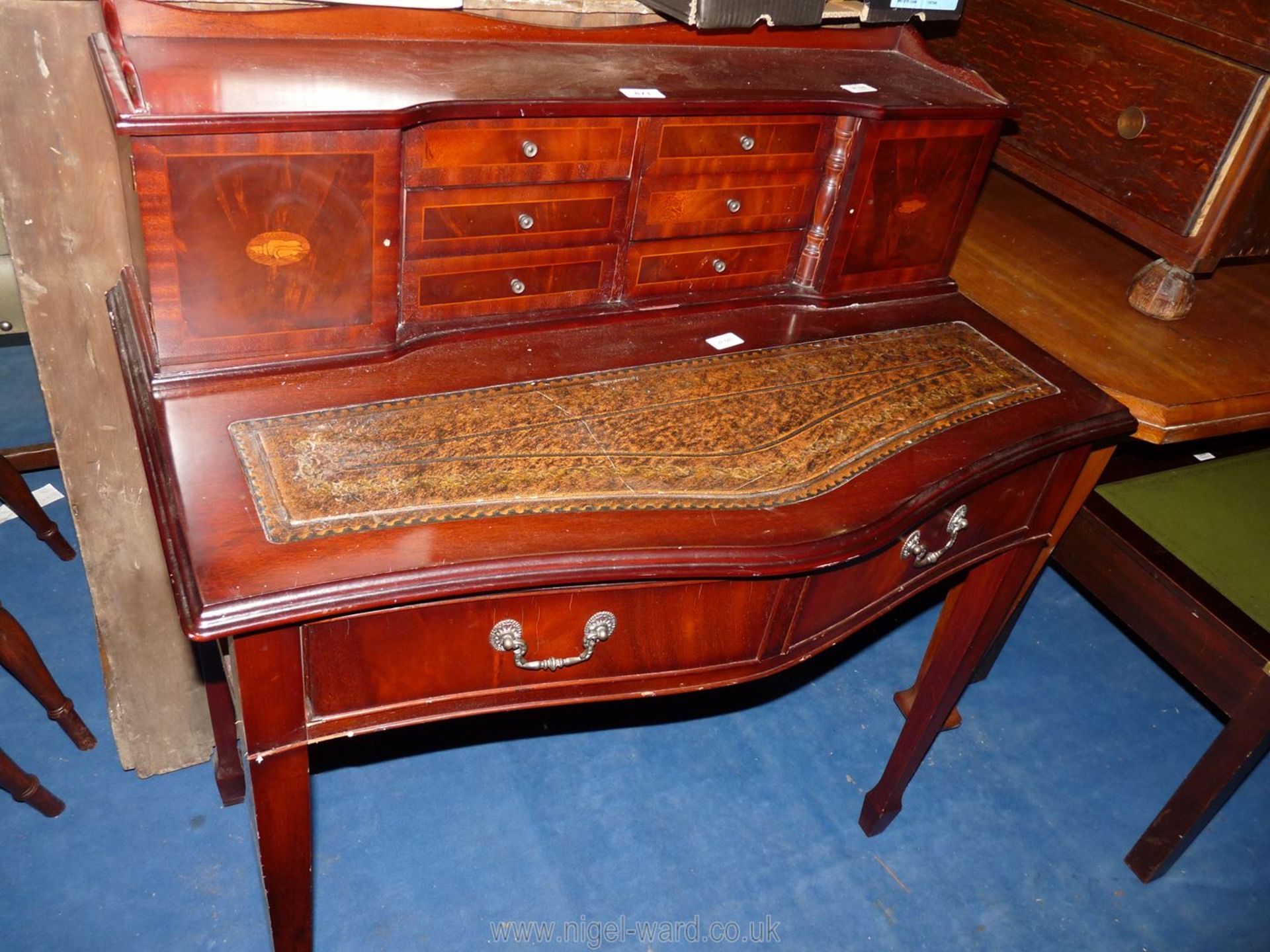 A repro writing desk with tooled leather insert, 36" wide x 40" high x 19" deep.