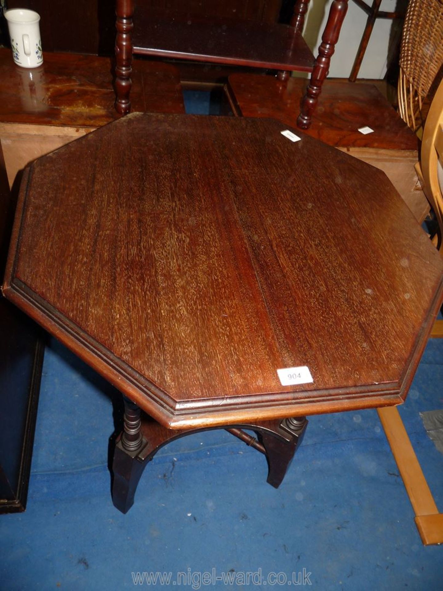 An octagonal topped occasional table with lower shelf, 25 1/2" x 25 1/2" x 27 1/2" high.