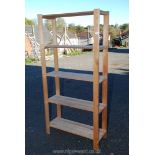 Wooden five shelf unit, 34'' x 69 1/2'' x 12''.