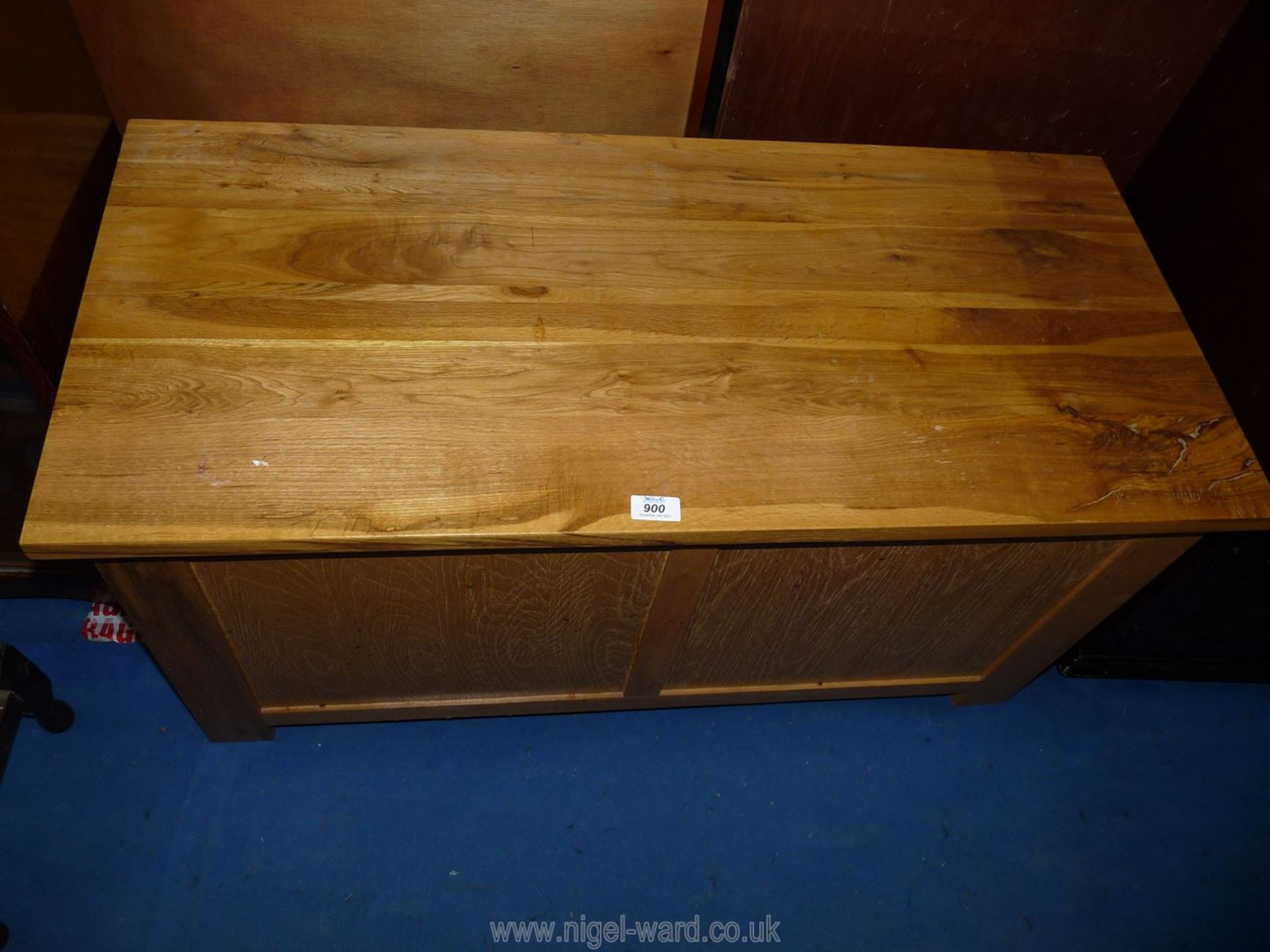 A light oak effect blanket box and contents, 39 1/2" wide x 18" deep x 19 1/2" high.