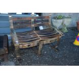 Two seater garden rocking bench made from old whisky barrels.
