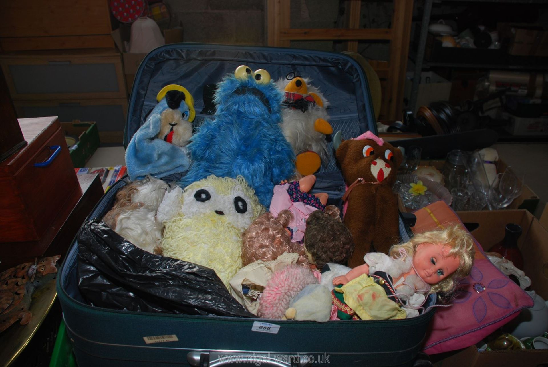 A case full of soft toys including hand puppet,