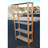 Wooden five shelf unit 34'' x 69 1/2'' x 12''.