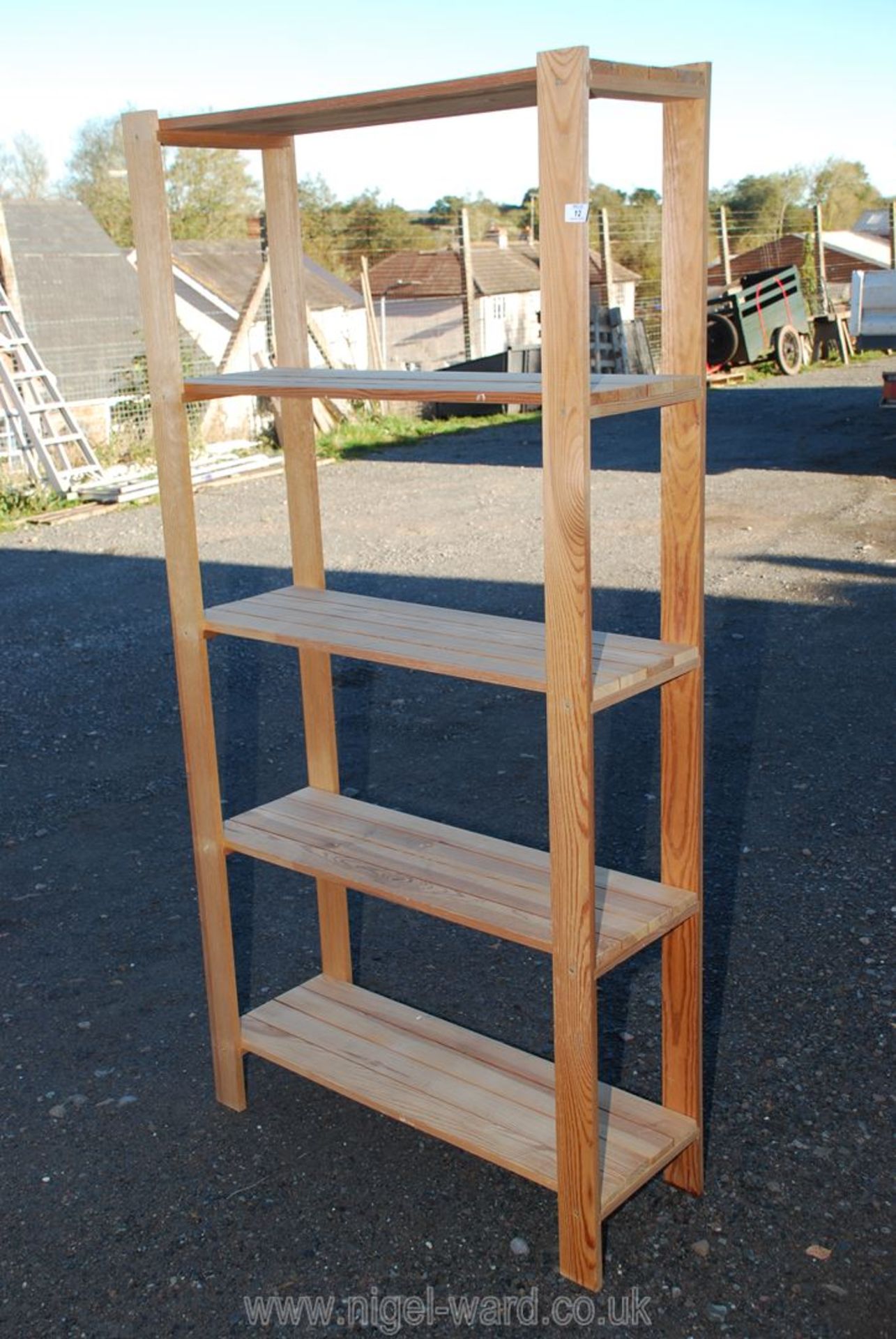 Wooden five shelf unit 34'' x 69 1/2'' x 12''.