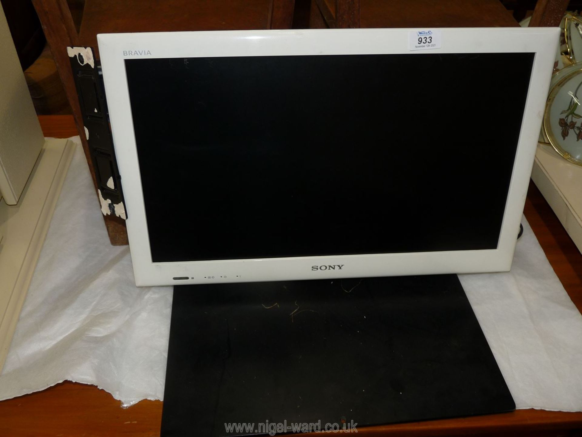A Sony flat screen TV, 22" screen with wall bracket attached.