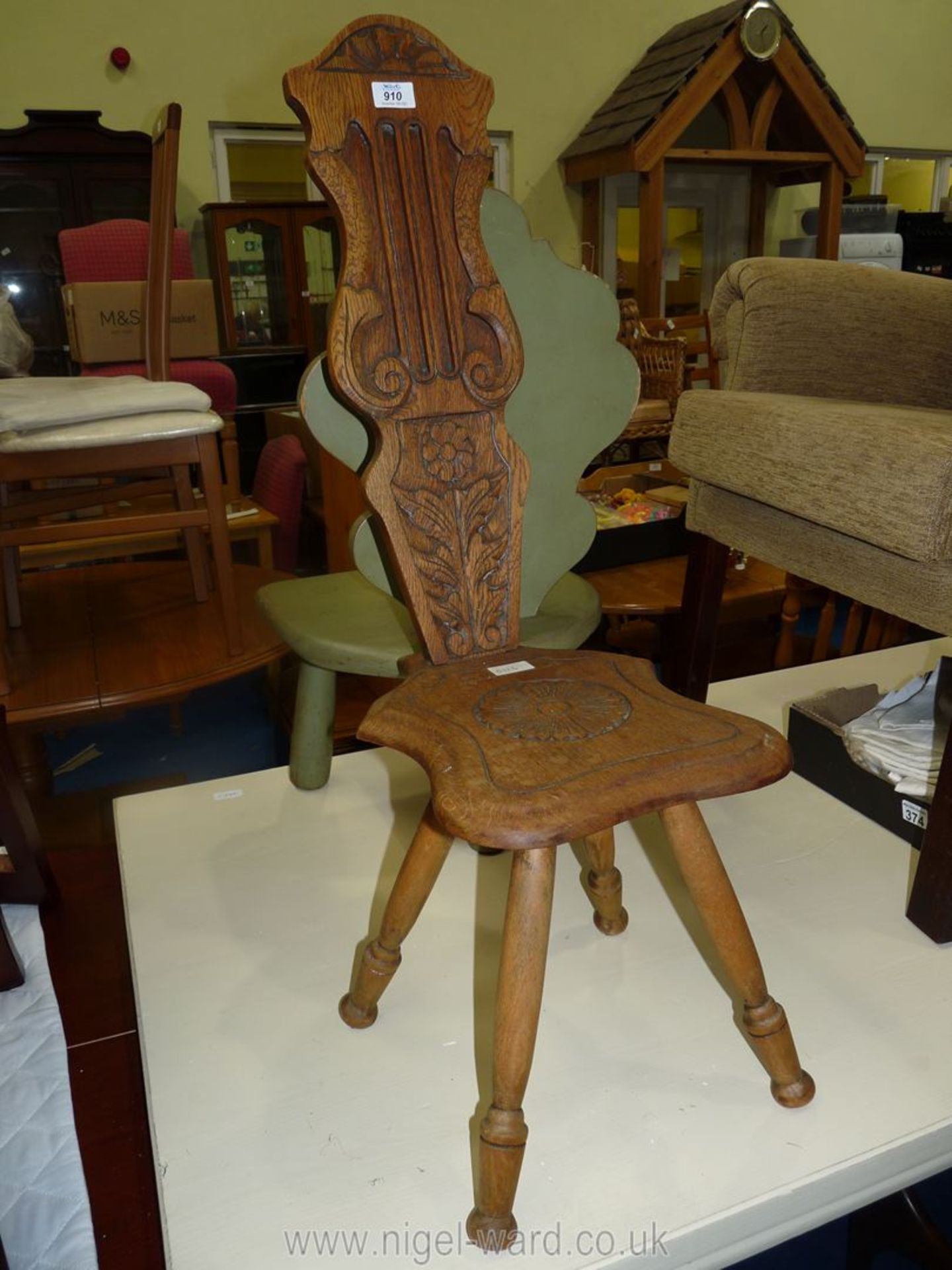 A hardwood spinning chair.