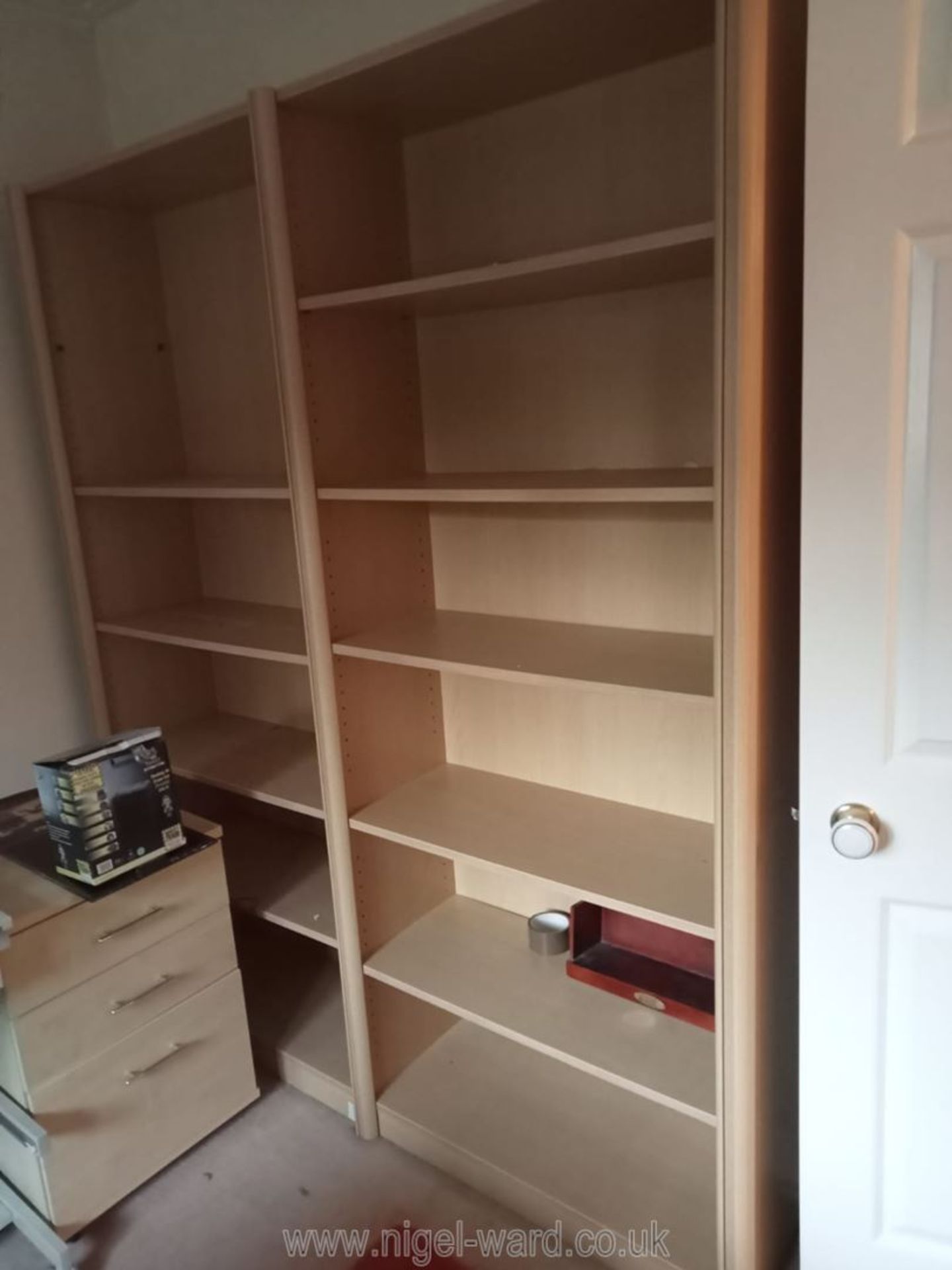 Two flat pack book shelves with adjustable shelves, 33" wide x 78" high x 13 3/4" deep.