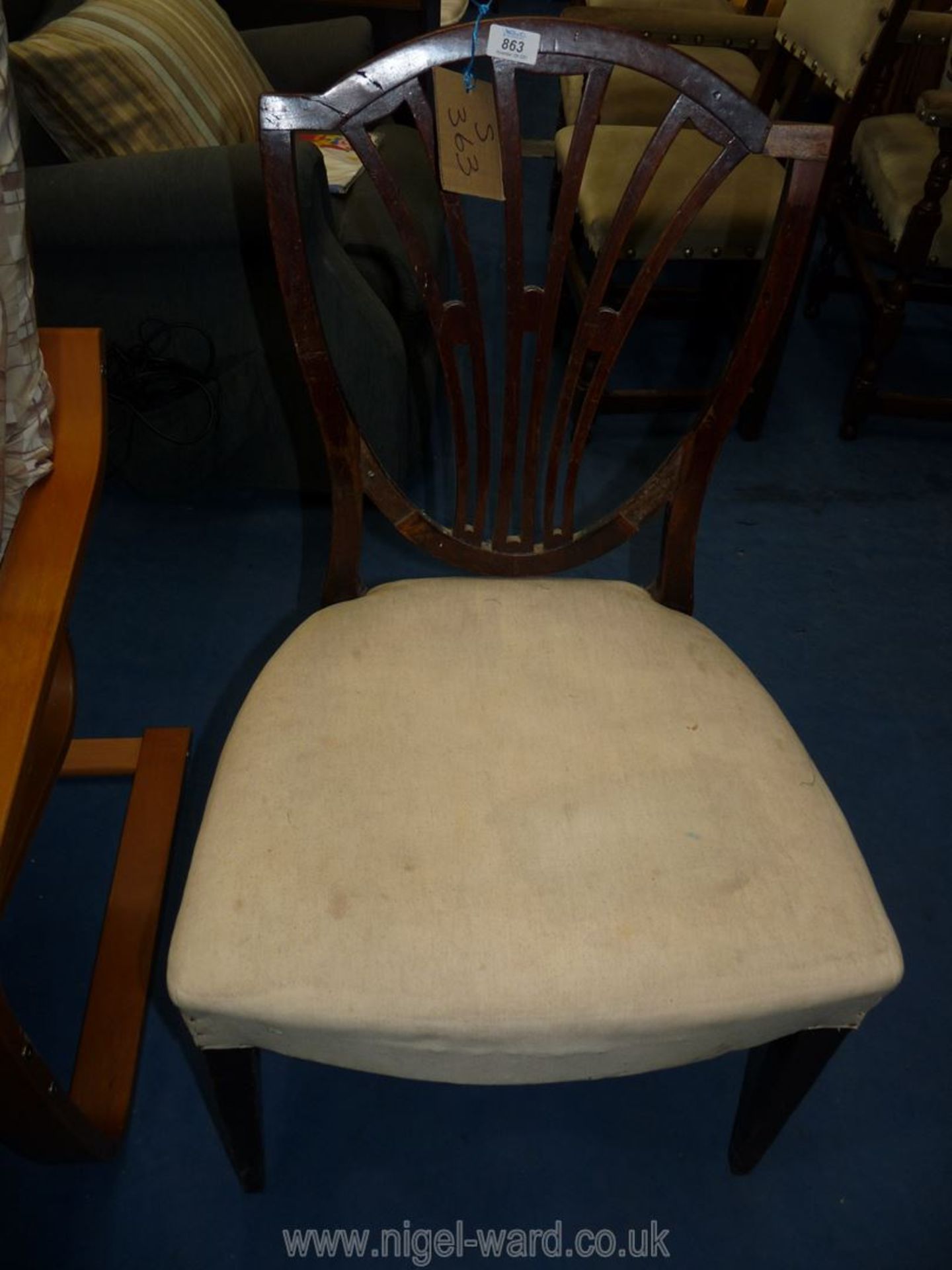 A darkwood framed hall chair with cream upholstered seat.