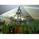 A wrought iron four branch Gothic style ceiling light with Fleurs de Lys pattern