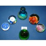 Six paperweights including Caithness, Mdina,