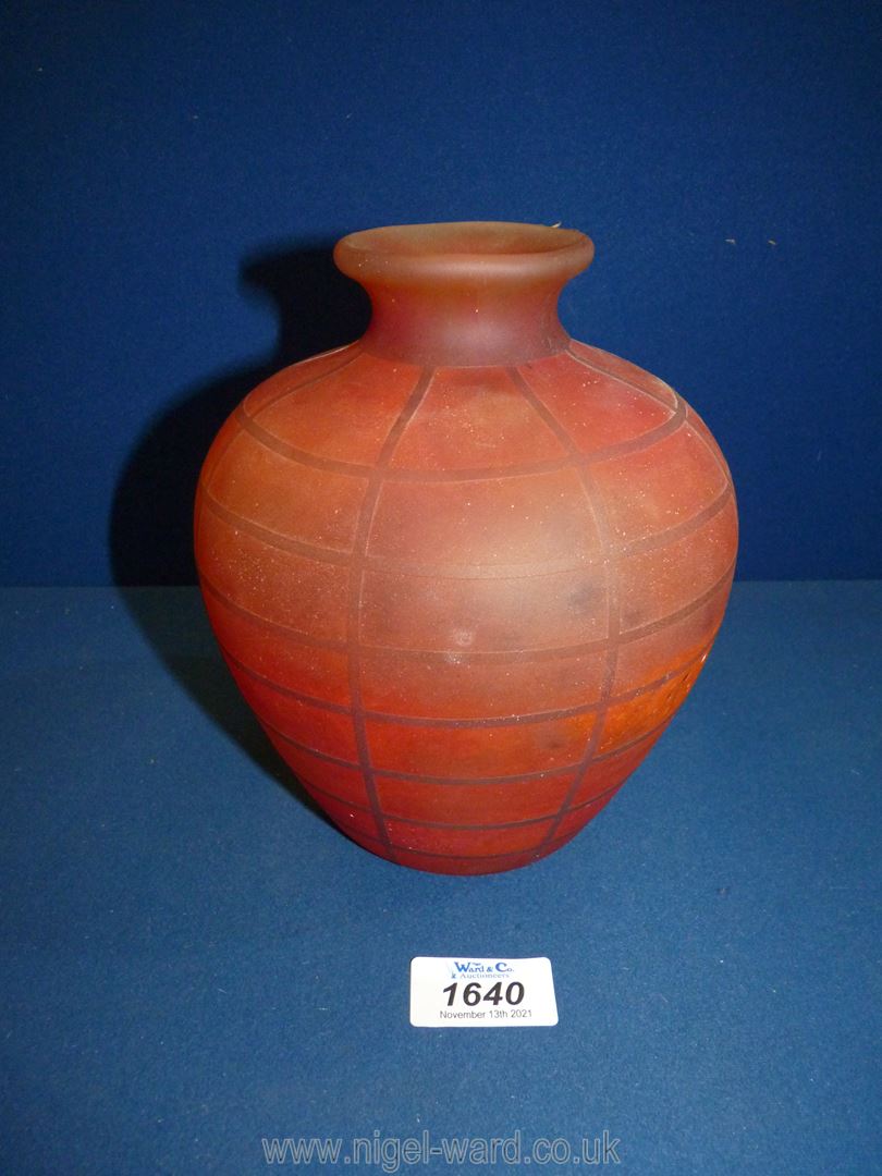 A red Studio style glass bulbous vase with grid pattern, marks to base, 7" tall.