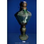 A green glass oil Lamp base shaped as a street lamp, 22" tall.