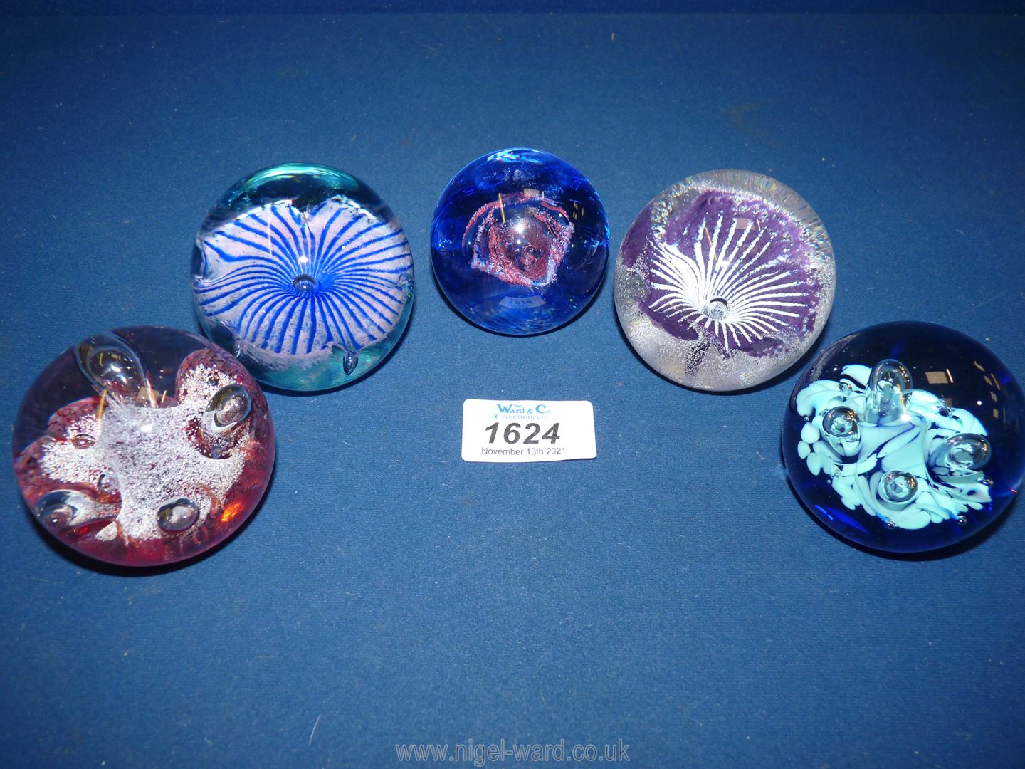 Five small Caithness paperweights to include; red mini moonflower, mini moon flower,