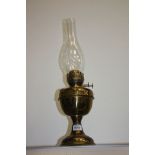 A brass oil lamp.