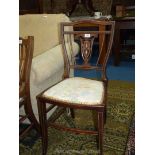 An elegant Mahogany Side Chair having lightwood stringing and ornate fretworked inlaid splat