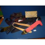 A small quantity of leather belts, various ties, gold coloured clutch bag, as new,