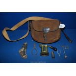 An antique Cartridge bag with leather components and containing 12 gauge cartridge re-loading