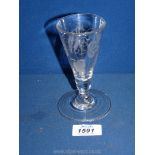 An 18th Century ale glass with a wide foot and funnel shaped bowl,