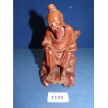 A well carved Chinese hardwood figure of a Sage, 6 1/4'' tall.