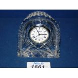 A small cut glass Waterford clock.