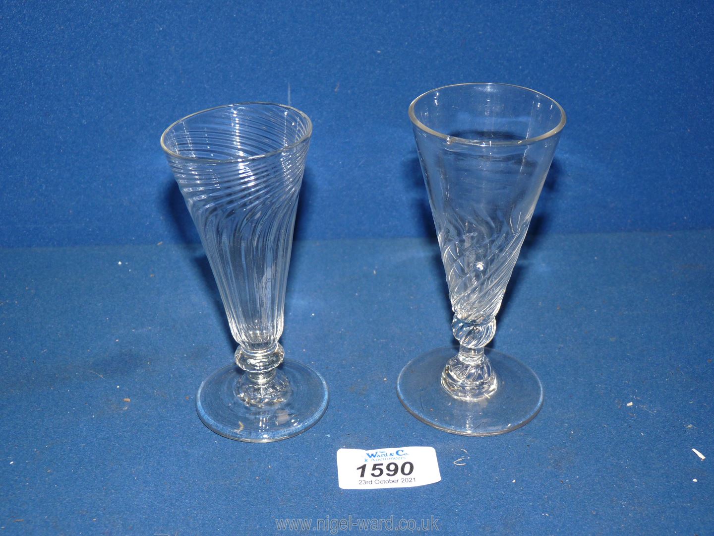 Two funnel shaped ale glasses with rough pontile (one with a crack).