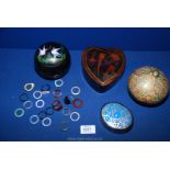 Three papier mache boxes, a heart shaped box and assorted plastic rings.