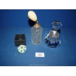 A heavy glass faceted kaleidoscope scent bottle with attached dipping rod,