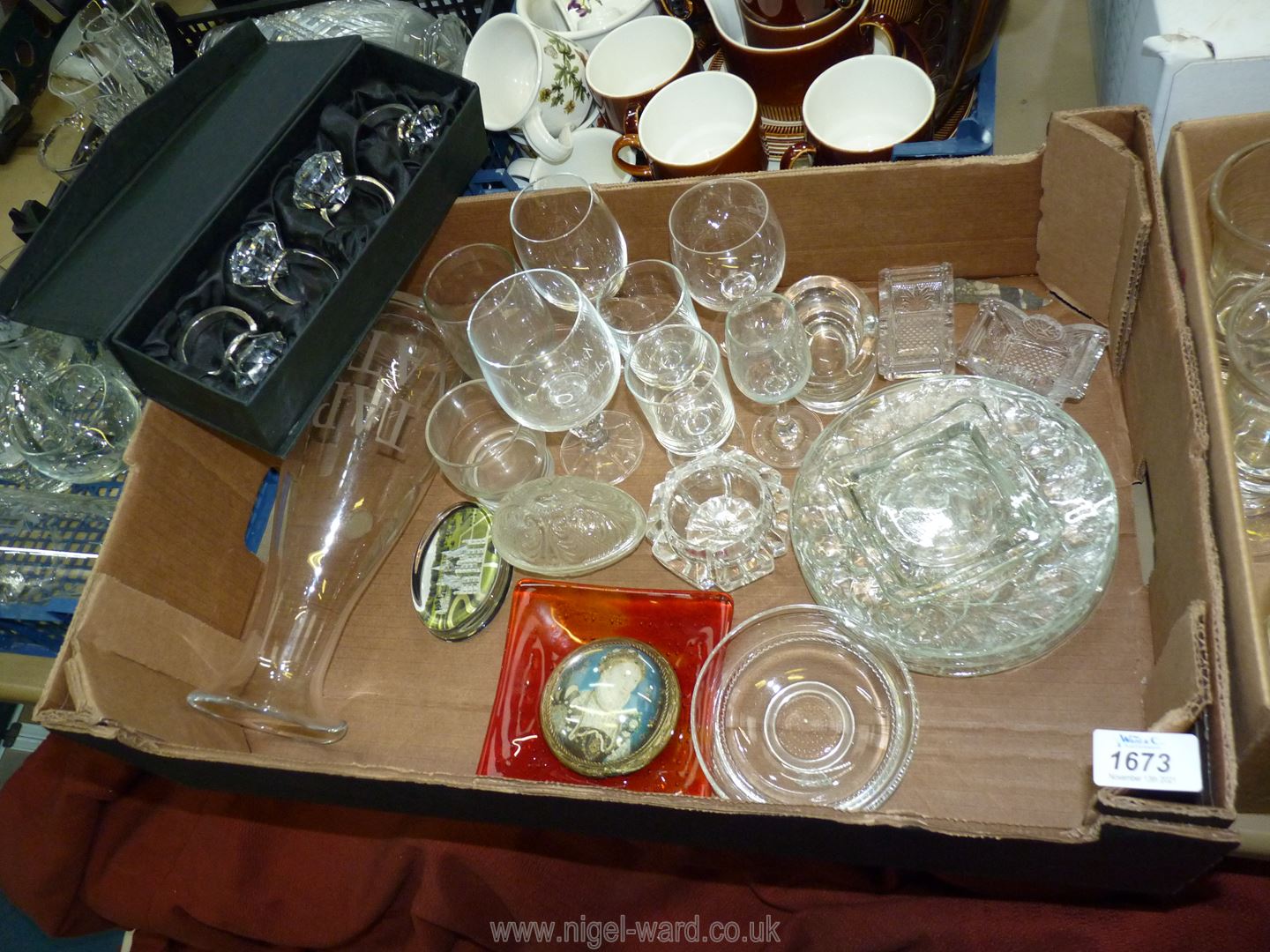 A quantity of glass including cake plates, salts, egg shaped dish, glass and metal napkin rings etc.