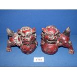 Two resin Chinese 'Dog of Fo' figures.