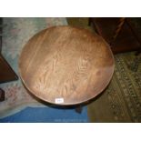 A circular Occasional Table standing on turned legs with perimeter stretchers,