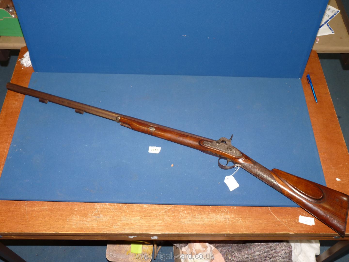 A Percussion cap single barrel sporting gun, the 30'' long Damascus barrel, 18mm calibre by ''Clark,