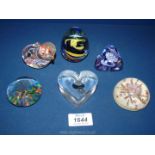 Six paperweights including Dartington heart shape, Caithness, pebbles,