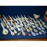 A good quantity of Chinese porcelain spoons. and an oriental jug.